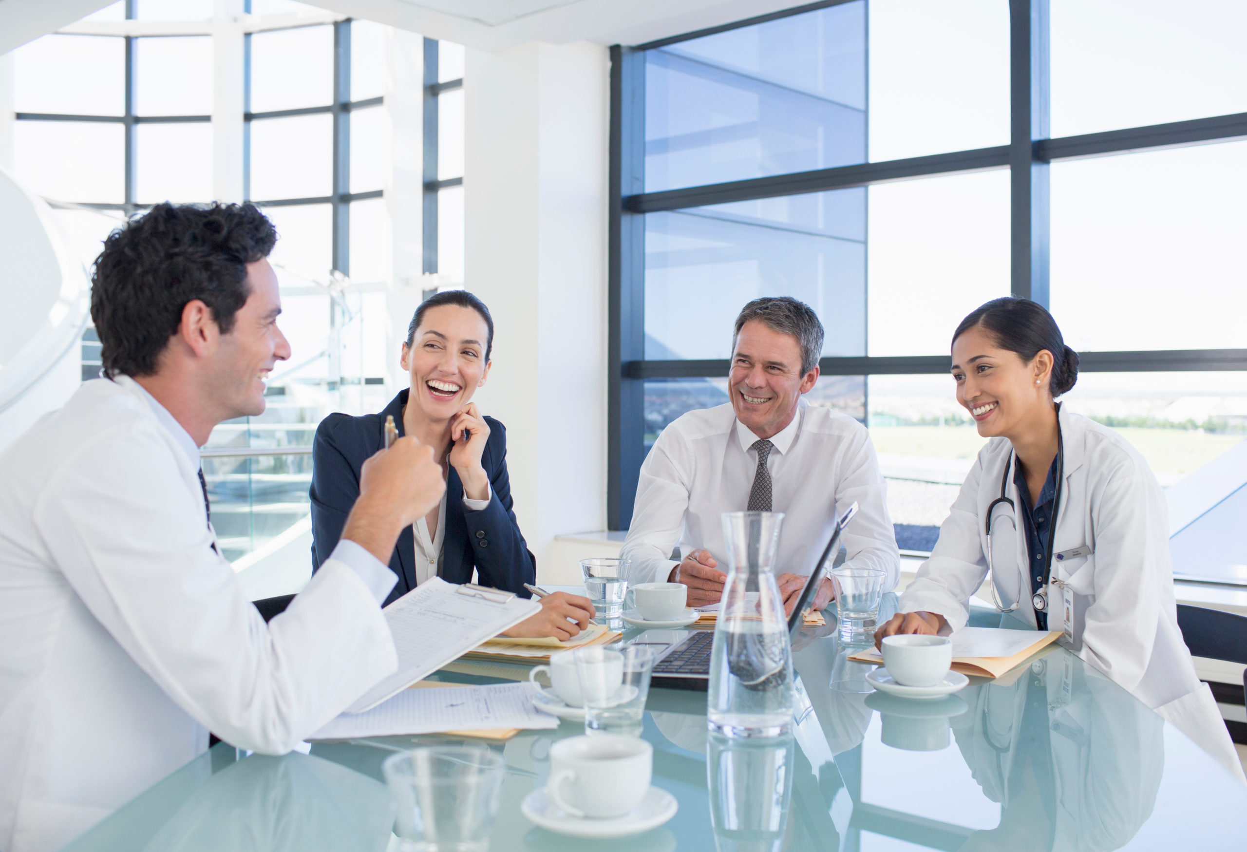 Doctors and business people talking in meeting